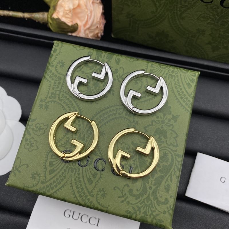 G*u*i earrings